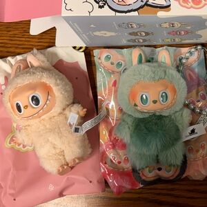 Two Labubus and One keychain